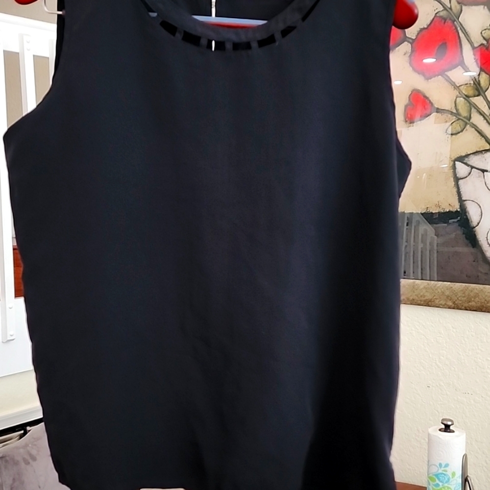 Sleeveless black silk top. Size Large
